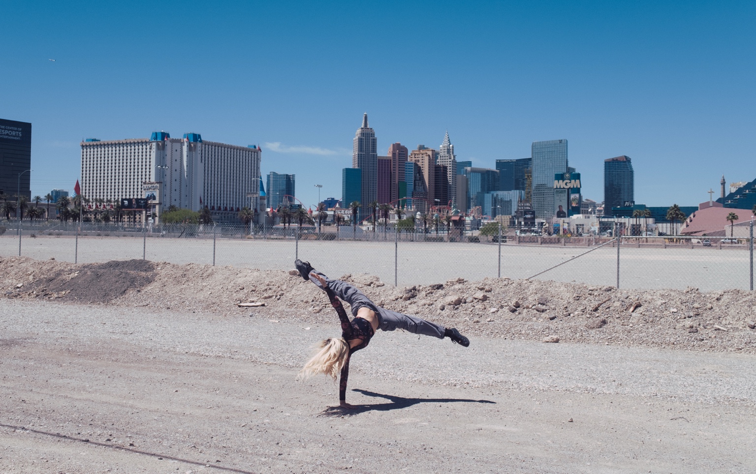 Performer handstand near Las Vegas skyline